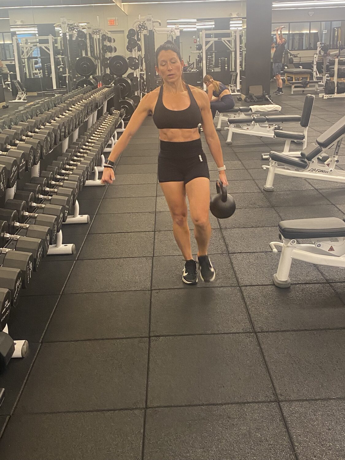 Jen, founder of HewLift, in the gym
